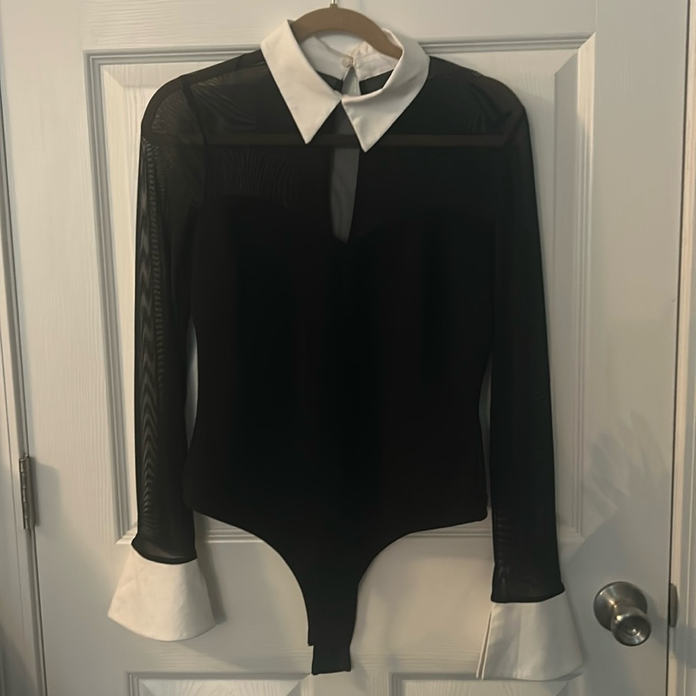 Black mesh bodysuit. White collar